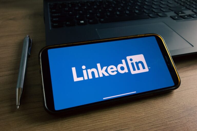 Phone with image of Linkedin logo on blue background