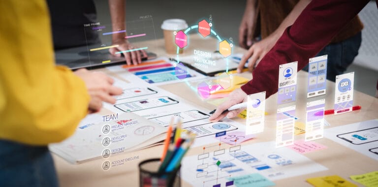 People at a table working on a website.
