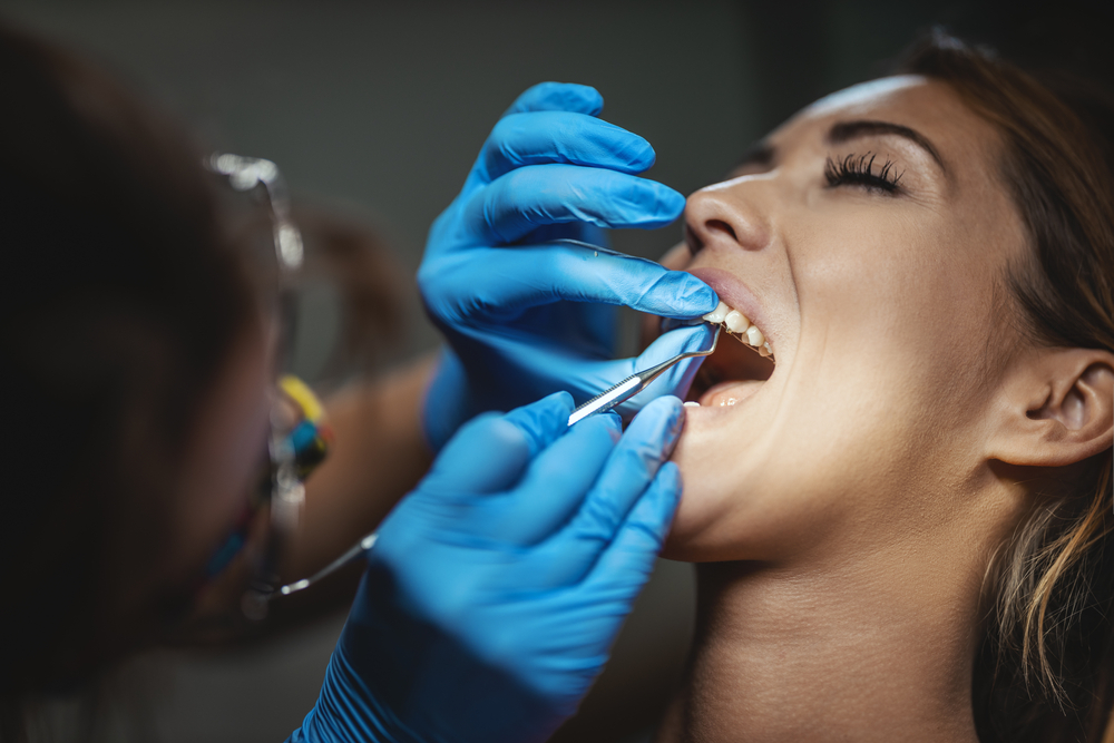 The,Beautiful,Young,Woman,Is,At,The,Dentist.,She,Sits